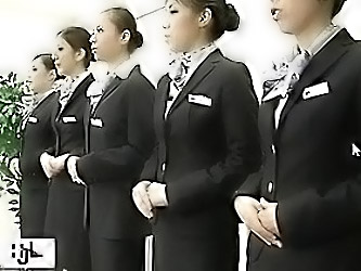 Japanese Stewardess Demonstrates...